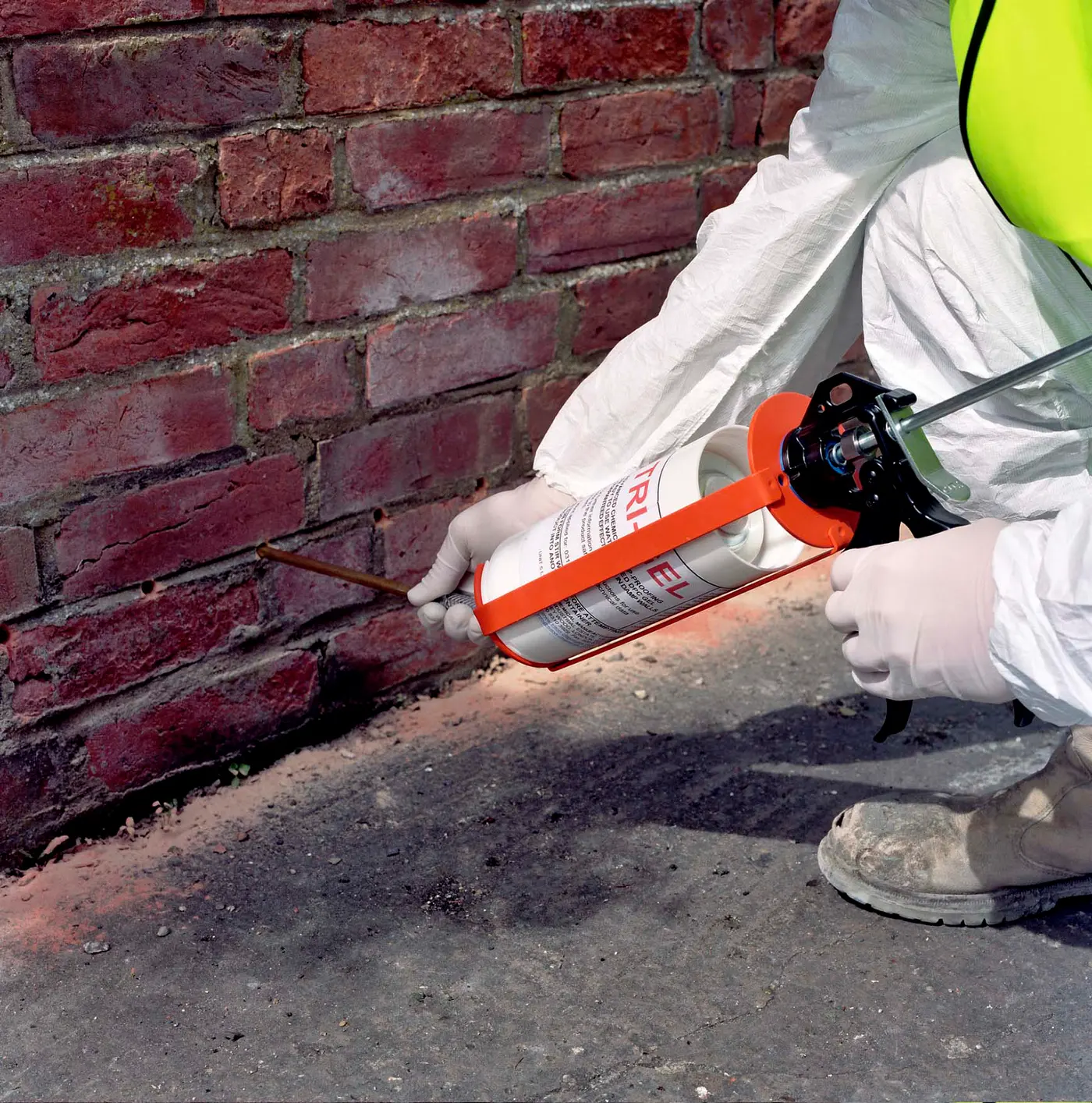 One of our team treating a wall for damp